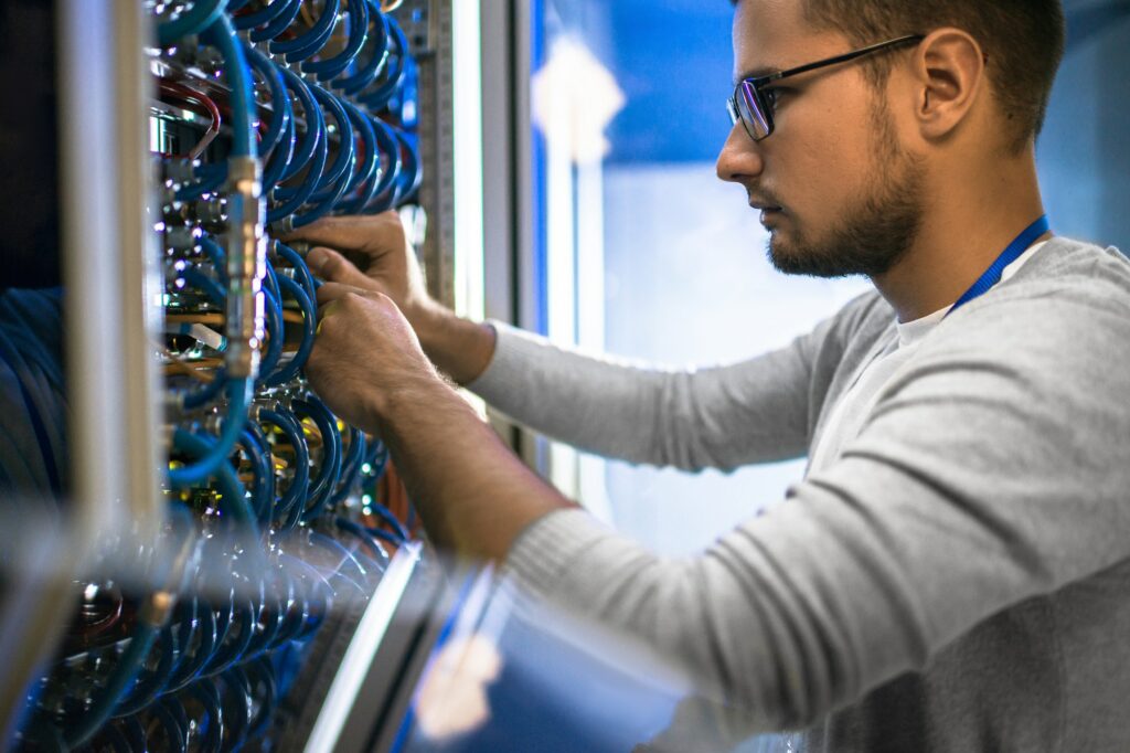 Engineer Working with Servers